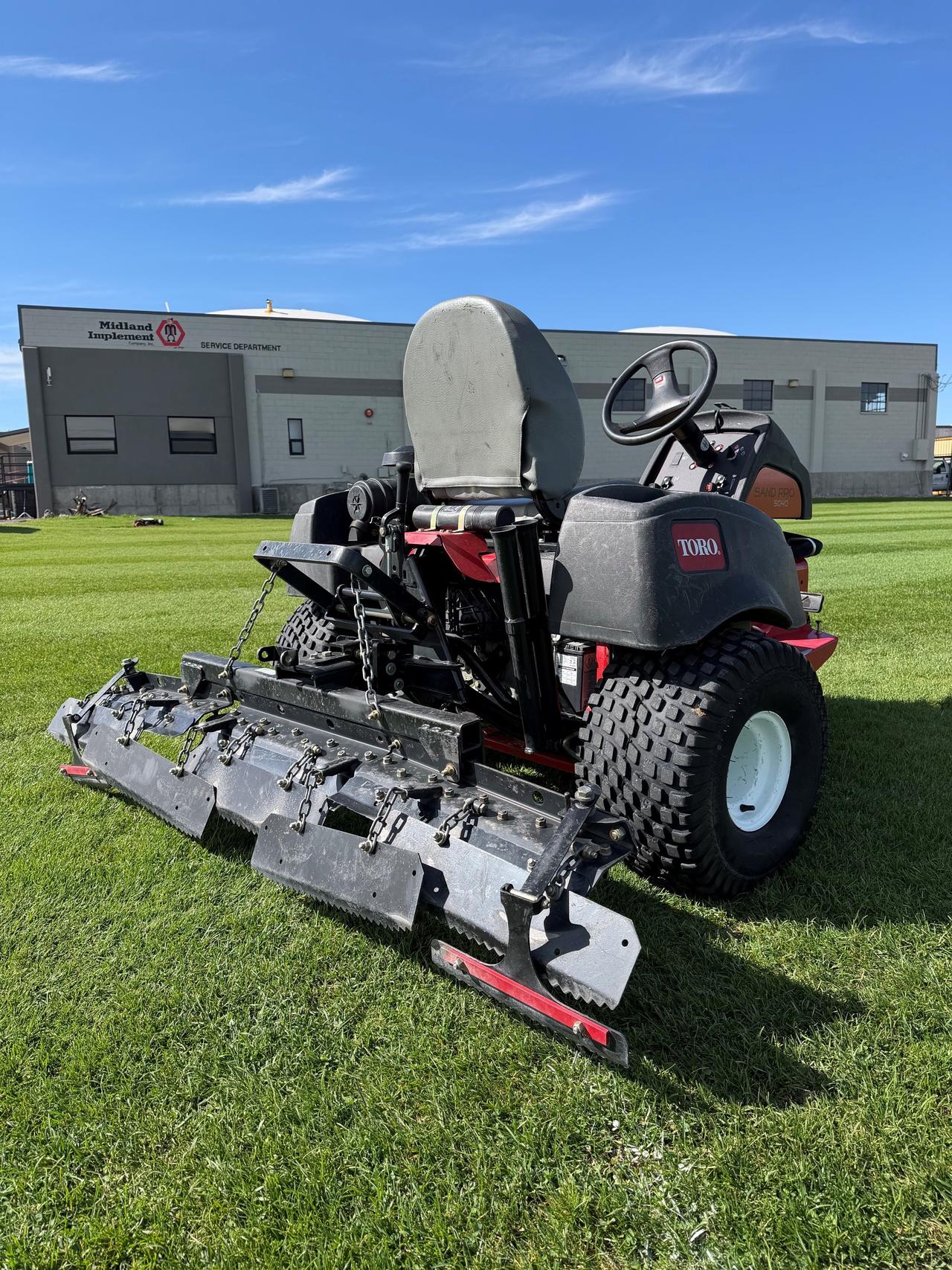 Toro Sand Pro® 5040 w/ Rear Tooth Rake Kit & Pivot Trowel Kit — photo 3 of 3